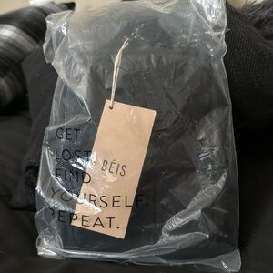 Black sports sling from beis.